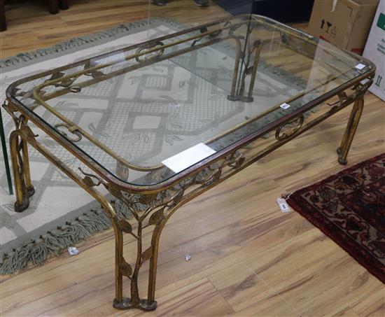 A gilt wrought iron and glass coffee table W.128cm.